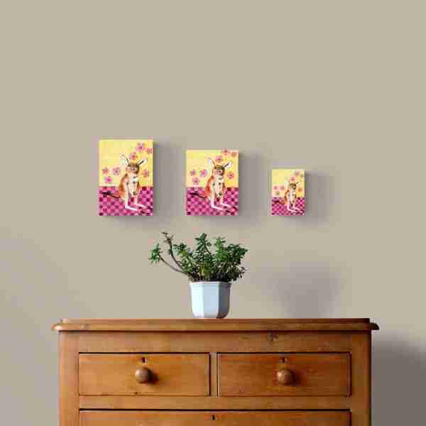 Kangaroo art prints on display above wooden cabinet