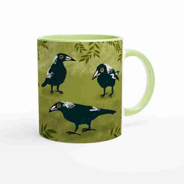 Green coffee mug with Australian magpies artwork