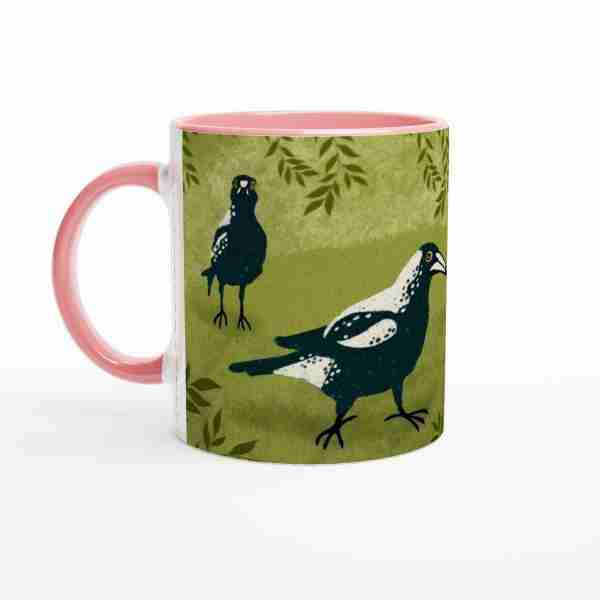 Pink coffee mug with Australian magpies artwork